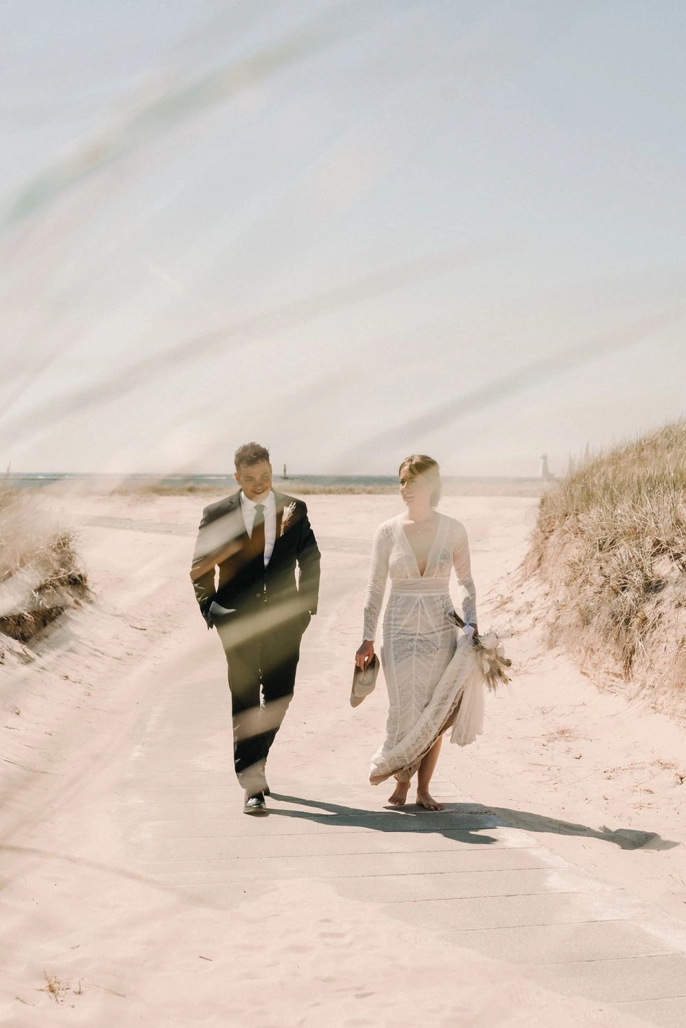 A couple walking together along the beach